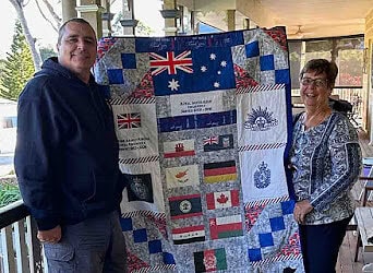 Presentation of quilt to Captain Carl by Heather B